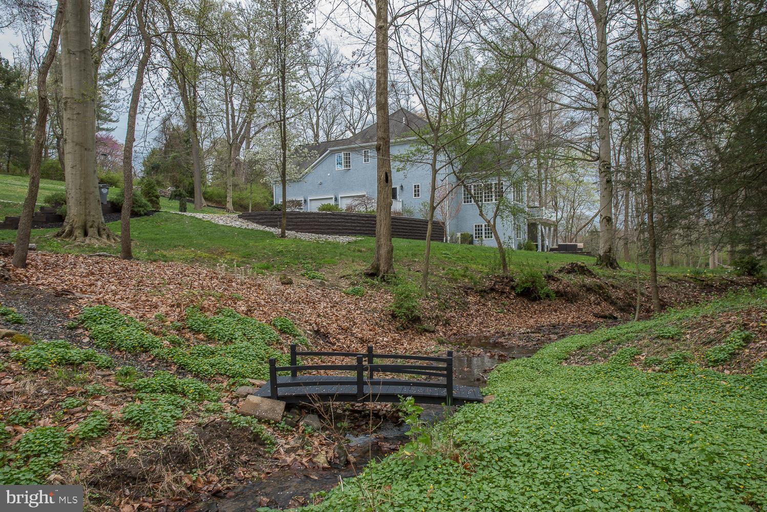 415 Darlington Road Media, PA 19063 - Photo 84 of 103 Rear Yard with creek and bridge
