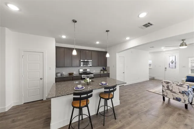 a kitchen with a table and chairs in it