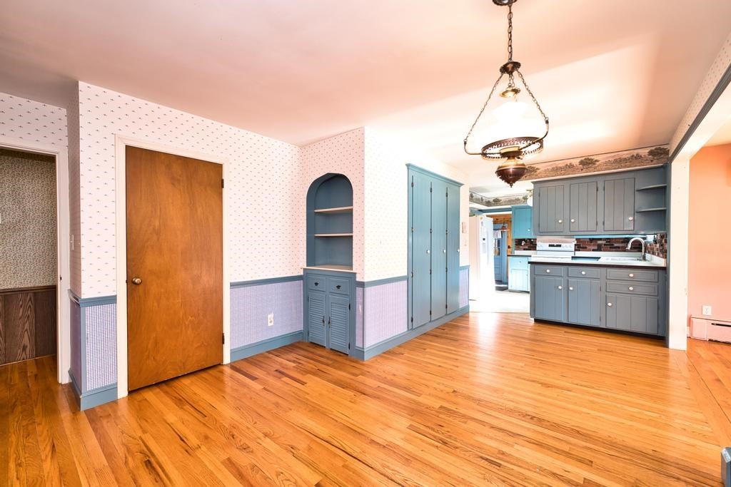 222 Blossom Road Westport, MA 02790 - Photo 14 of 37 a view of a kitchen with cabinets and wooden floor