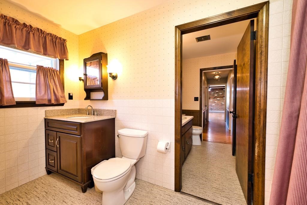 222 Blossom Road Westport, MA 02790 - Photo 18 of 37 a bathroom with a toilet sink and mirror