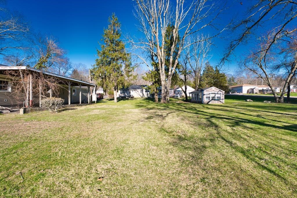 222 Blossom Road Westport, MA 02790 - Photo 33 of 37 a view of a park that has a large tree