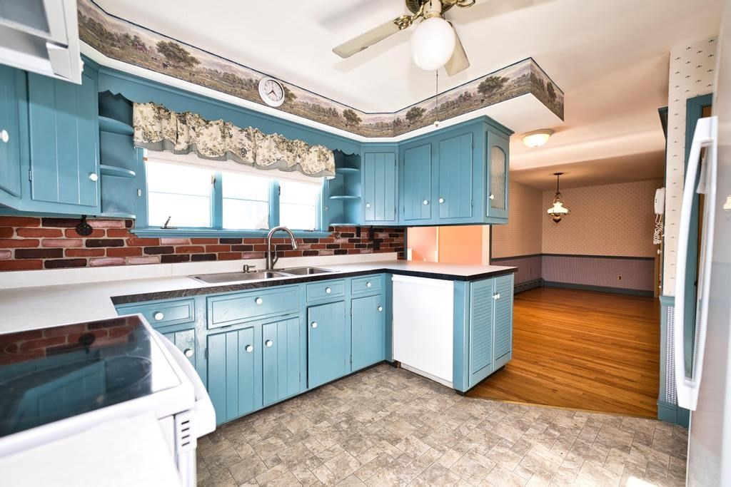 222 Blossom Road Westport, MA 02790 - Photo 7 of 37 a kitchen with stainless steel appliances granite countertop a sink and a cabinets