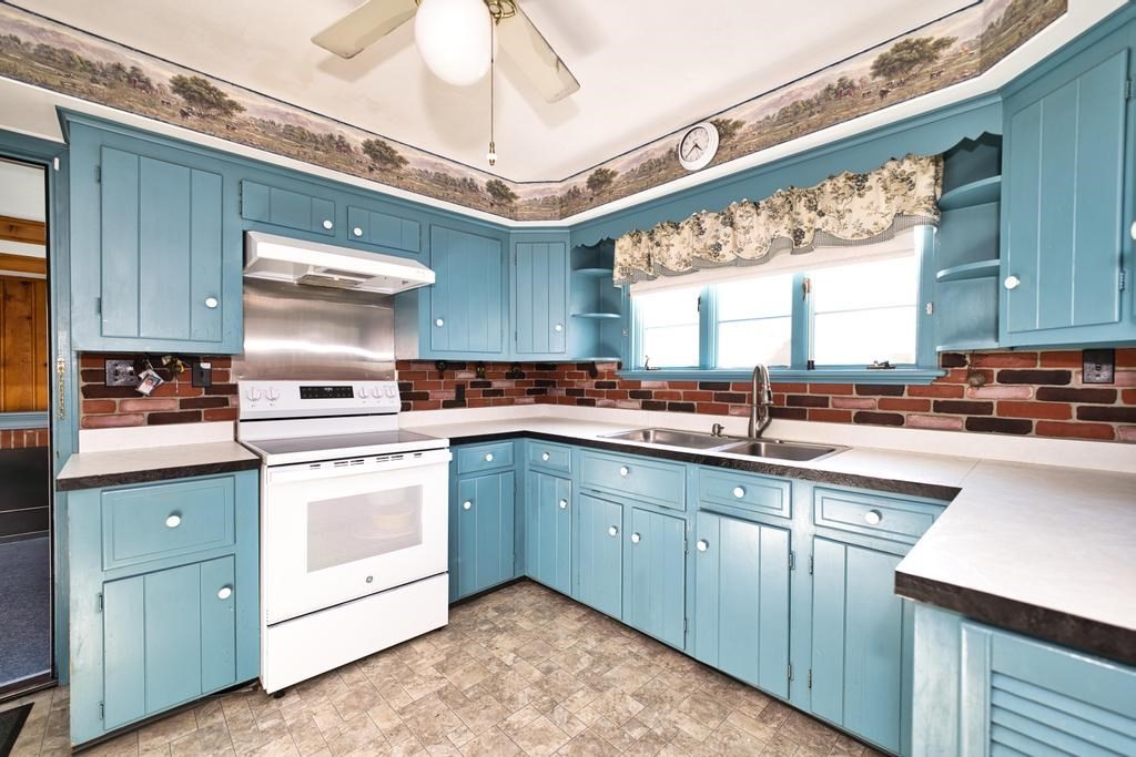 222 Blossom Road Westport, MA 02790 - Photo 8 of 37 a kitchen with stainless steel appliances granite countertop a sink and cabinets