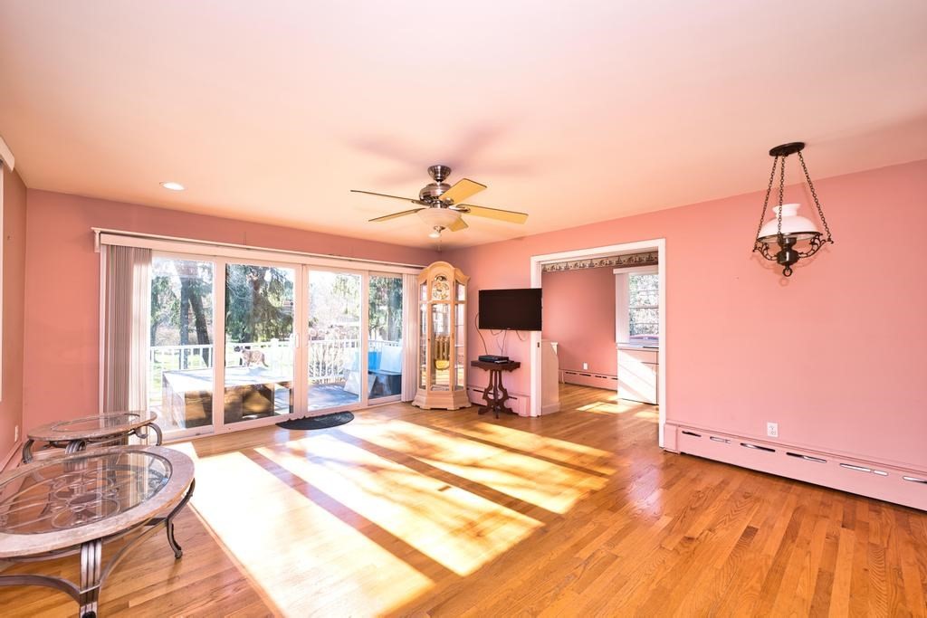 222 Blossom Road Westport, MA 02790 - Photo 10 of 37 a living room with a bed furniture and a large window