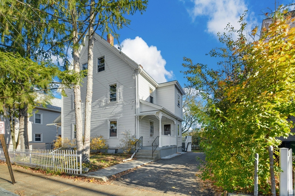 10 Middle Street, Unit 10 Newton, MA 02458 - Photo 1 of 19 a front view of a house with garden