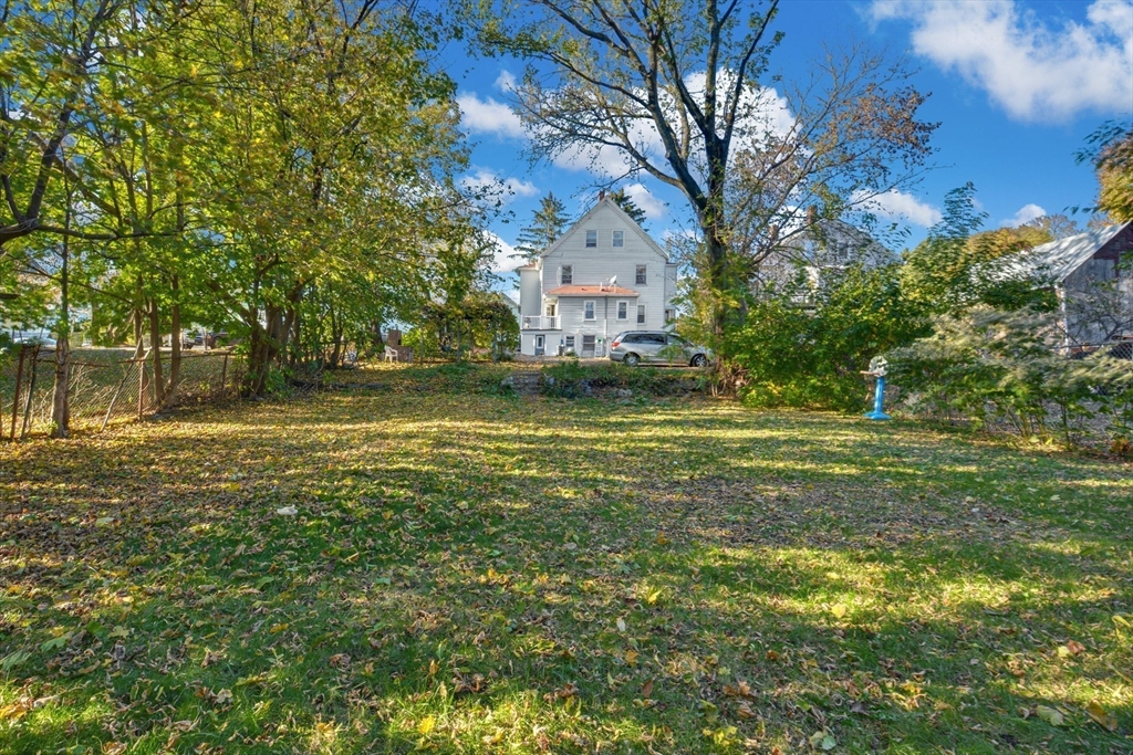 10 Middle Street, Unit 10 Newton, MA 02458 - Photo 11 of 19 a view of a yard with a tree