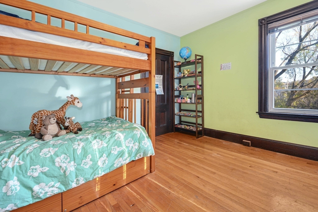 10 Middle Street, Unit 10 Newton, MA 02458 - Photo 14 of 19 a bedroom with a large bed and a window