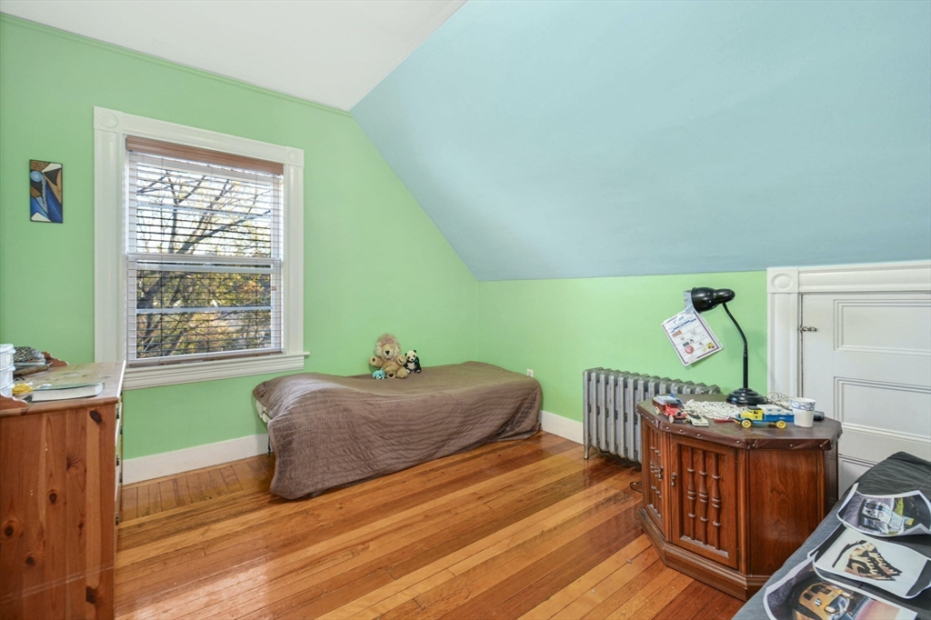 10 Middle Street, Unit 10 Newton, MA 02458 - Photo 15 of 19 a bedroom with furniture and a window