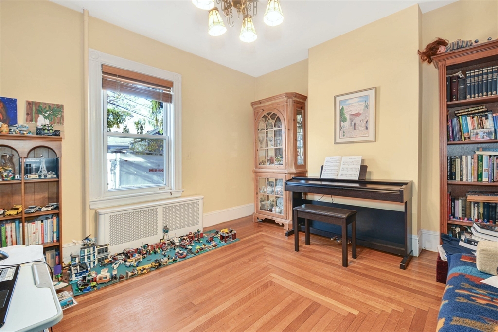 10 Middle Street, Unit 10 Newton, MA 02458 - Photo 4 of 19 a living room with furniture and a potted plant