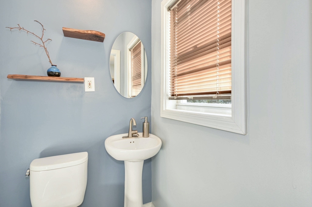 10 Middle Street, Unit 10 Newton, MA 02458 - Photo 9 of 19 a bathroom with a sink and a mirror