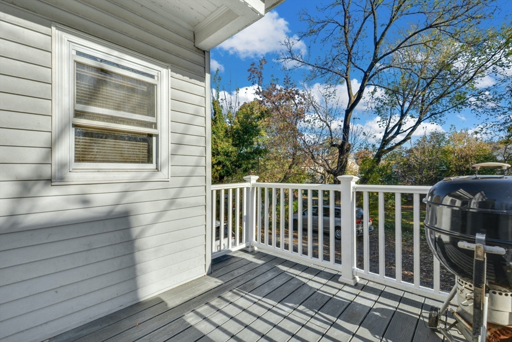 10 Middle Street, Unit 10 Newton, MA 02458 - Photo 10 of 19 a view of a roof with wooden floor and fence and a floor to ceiling window