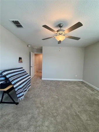 a very nice looking room with a ceiling fan