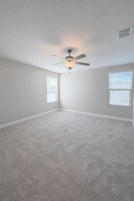 25118 Lambrusco Loop Lutz, FL 33559 - Photo 16 of 26 a view of a livingroom with a fan