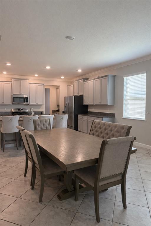 25118 Lambrusco Loop Lutz, FL 33559 - Photo 21 of 26 a view of a dining room with furniture