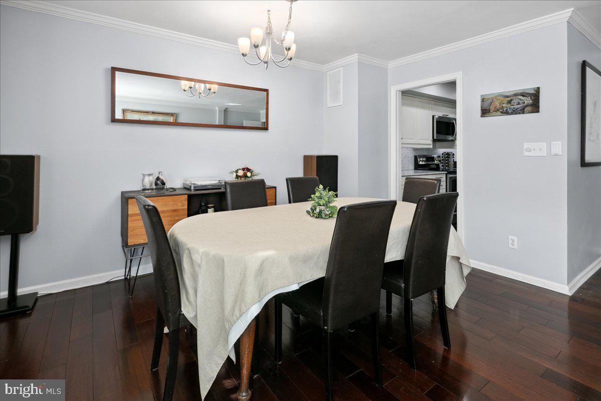 9623 Blake Lane Fairfax, VA 22031 - Photo 14 of 60 a view of a dining room with furniture and wooden floor