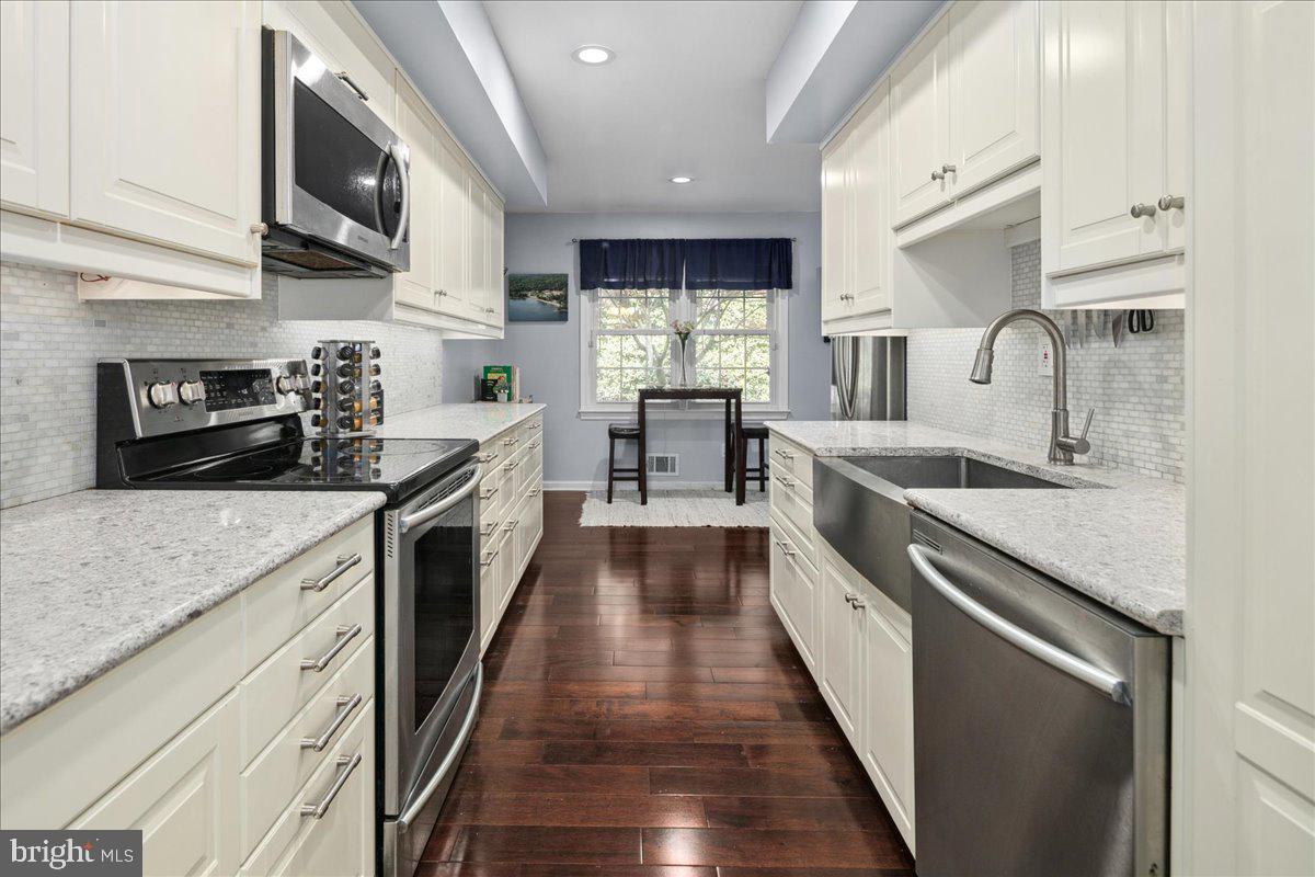 9623 Blake Lane Fairfax, VA 22031 - Photo 19 of 60 a large kitchen with stainless steel appliances granite countertop lots of counter space and a sink