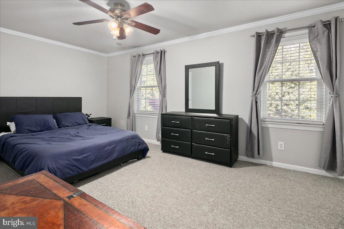 9623 Blake Lane Fairfax, VA 22031 - Photo 25 of 60 a bedroom with a bed and a mirror on the dresser