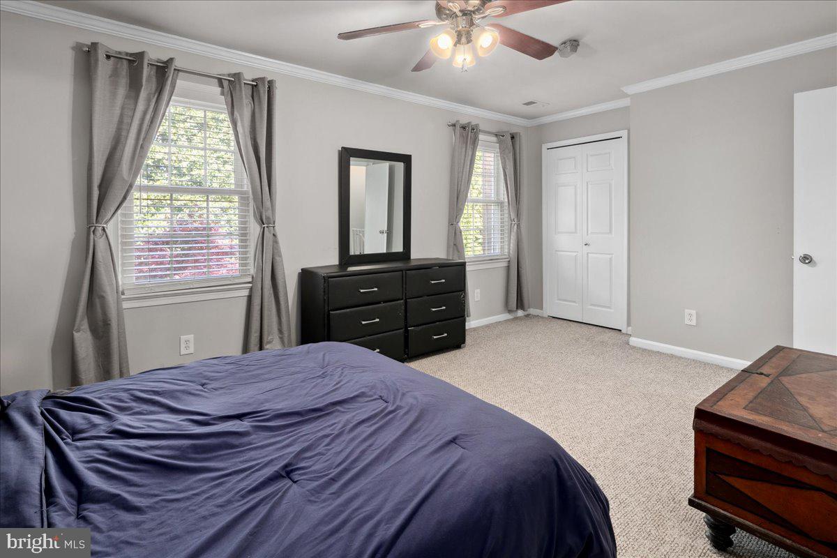 9623 Blake Lane Fairfax, VA 22031 - Photo 28 of 60 a bedroom with a bed and window