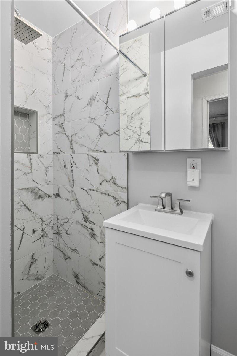 9623 Blake Lane Fairfax, VA 22031 - Photo 31 of 60 a bathroom with a sink toilet and shower