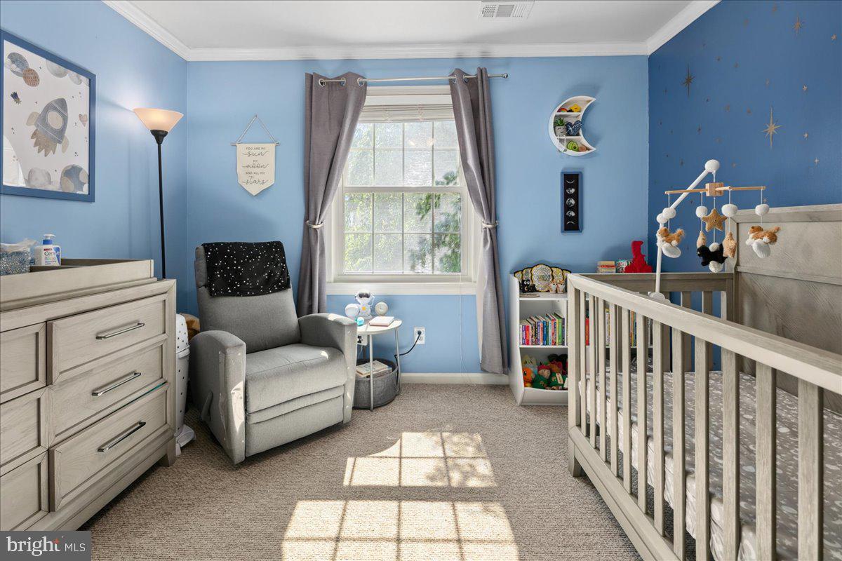 9623 Blake Lane Fairfax, VA 22031 - Photo 34 of 60 a bedroom with furniture and a window