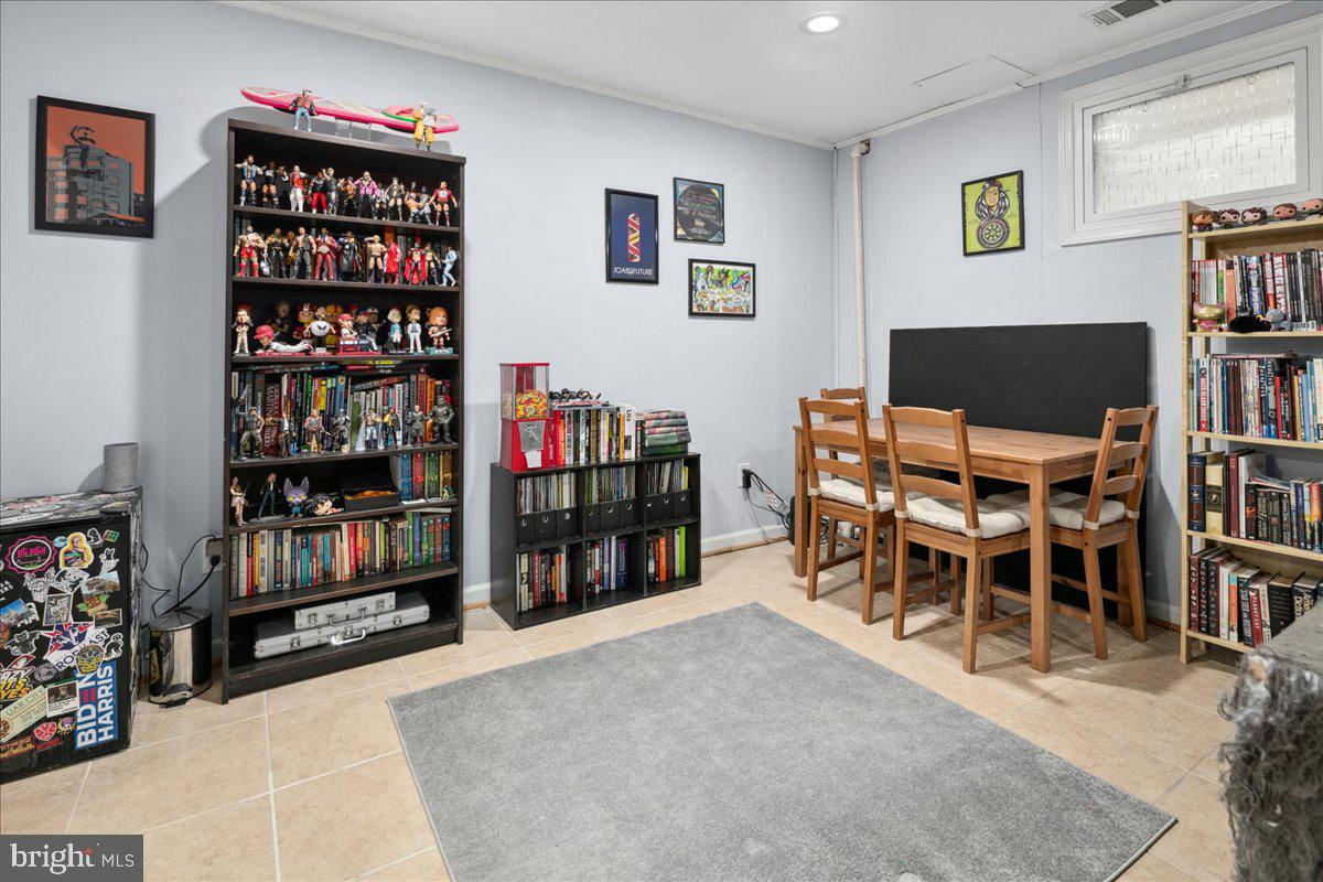 9623 Blake Lane Fairfax, VA 22031 - Photo 43 of 60 a living room with lots of furniture and a book shelf