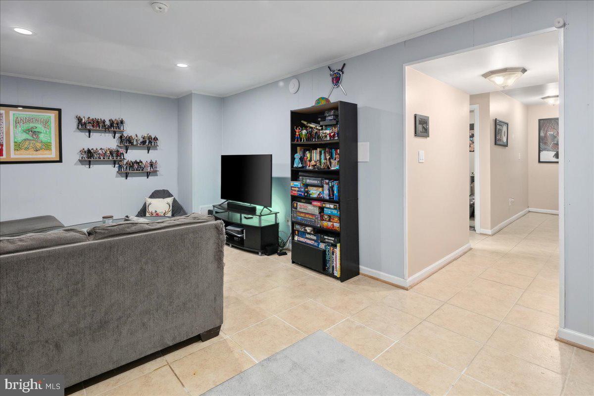 9623 Blake Lane Fairfax, VA 22031 - Photo 45 of 60 a living room with furniture and a flat screen tv