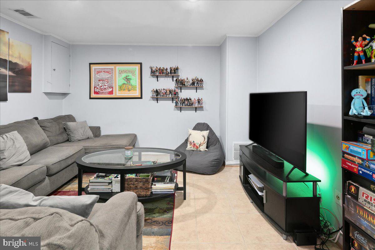 9623 Blake Lane Fairfax, VA 22031 - Photo 46 of 60 a living room with furniture and a flat screen tv