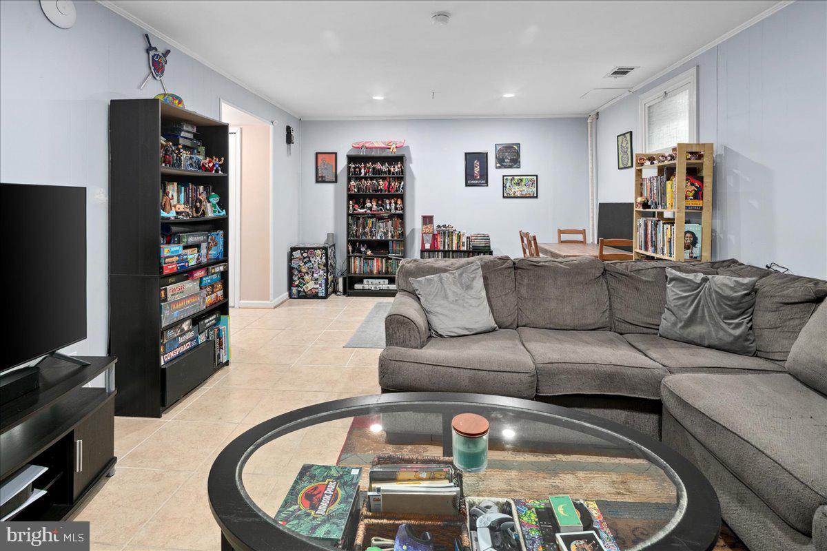 9623 Blake Lane Fairfax, VA 22031 - Photo 48 of 60 a living room with furniture and a flat screen tv