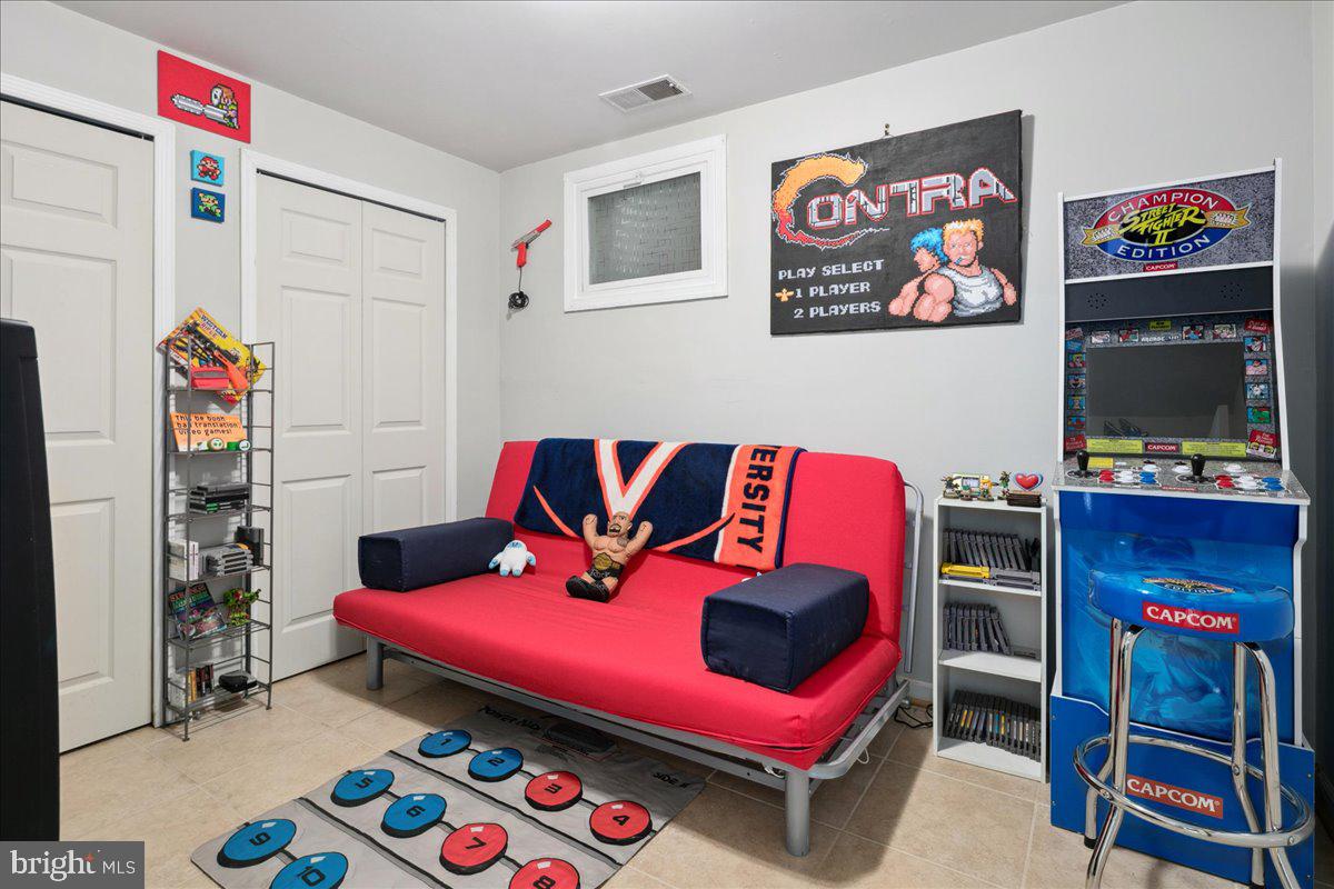 9623 Blake Lane Fairfax, VA 22031 - Photo 50 of 60 a living room with furniture and a flat screen tv