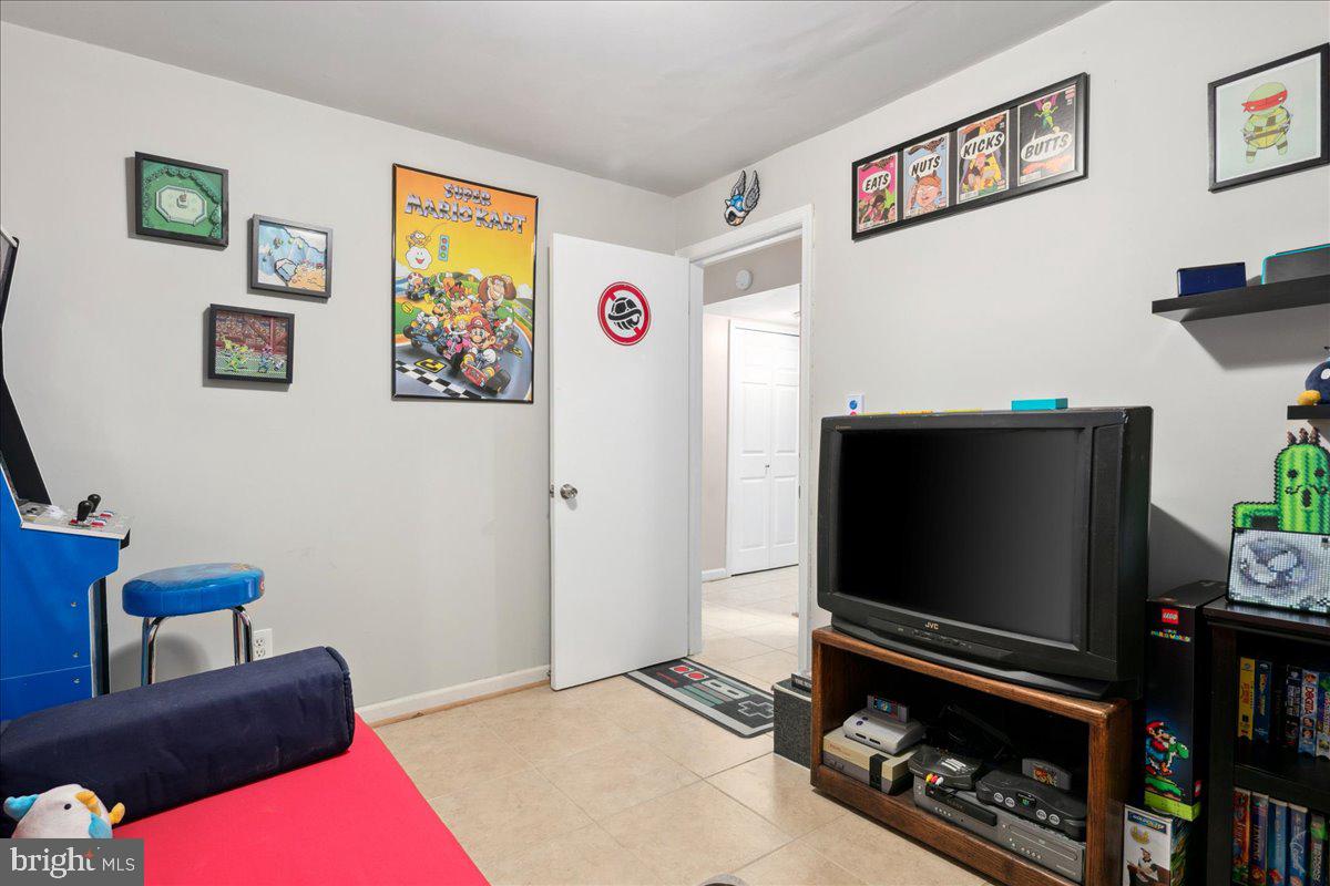 9623 Blake Lane Fairfax, VA 22031 - Photo 52 of 60 a living room with furniture and a flat screen tv