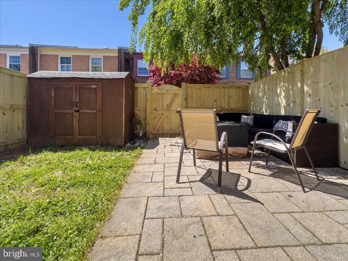 9623 Blake Lane Fairfax, VA 22031 - Photo 55 of 60 a backyard of a house with table and chairs