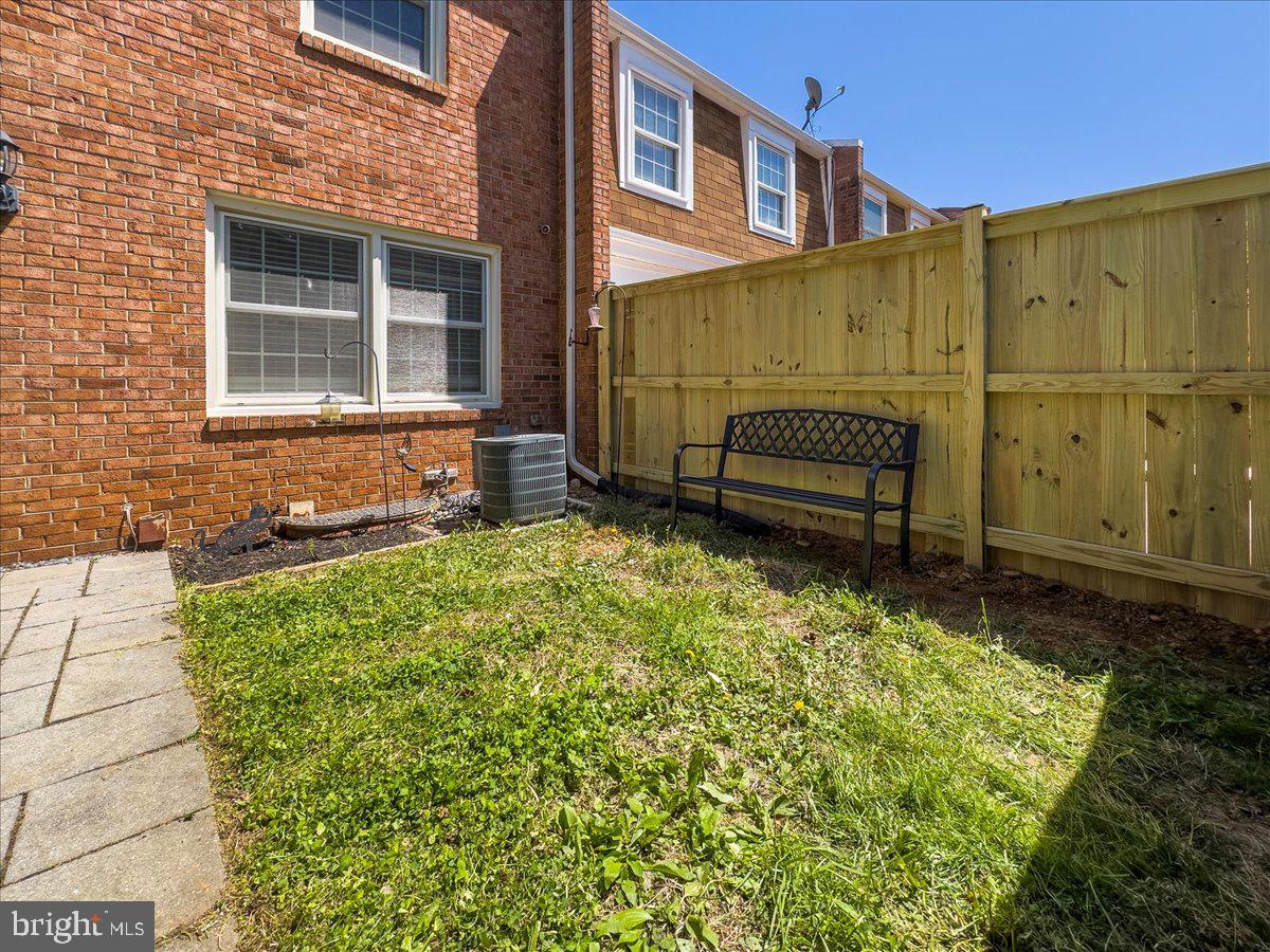 9623 Blake Lane Fairfax, VA 22031 - Photo 57 of 60 a front view of a house with a garden