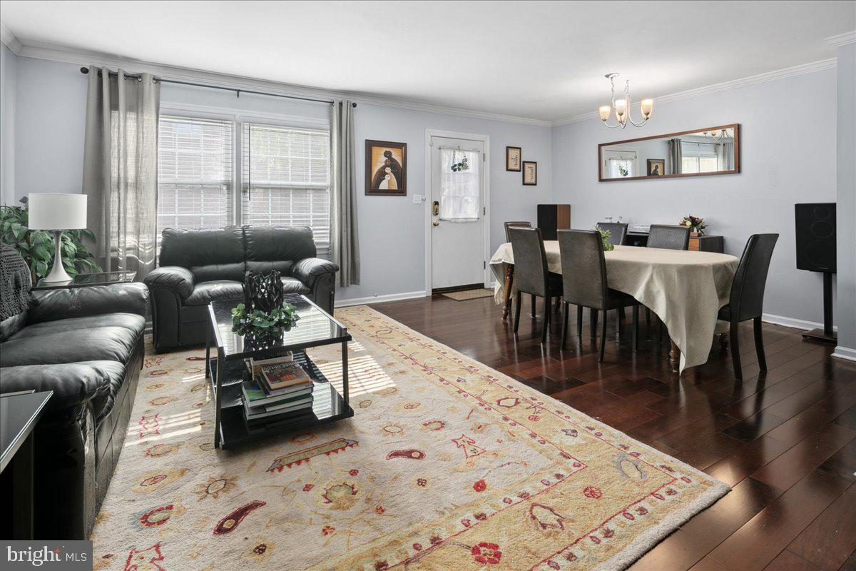 9623 Blake Lane Fairfax, VA 22031 - Photo 7 of 60 a living room with furniture a window and a dining table