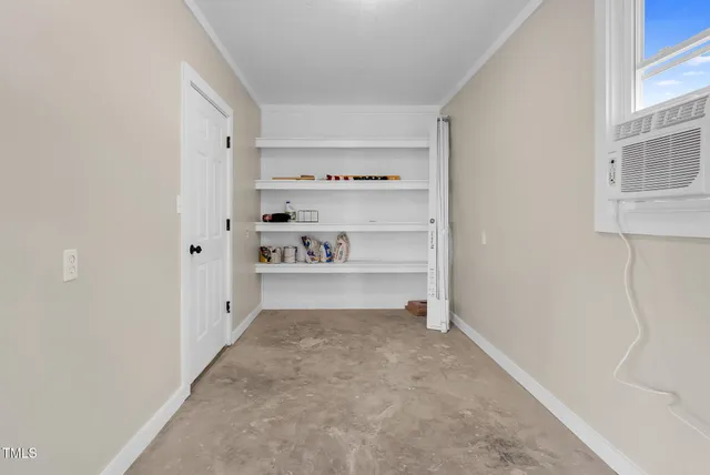 a view of kitchen and white cabinets