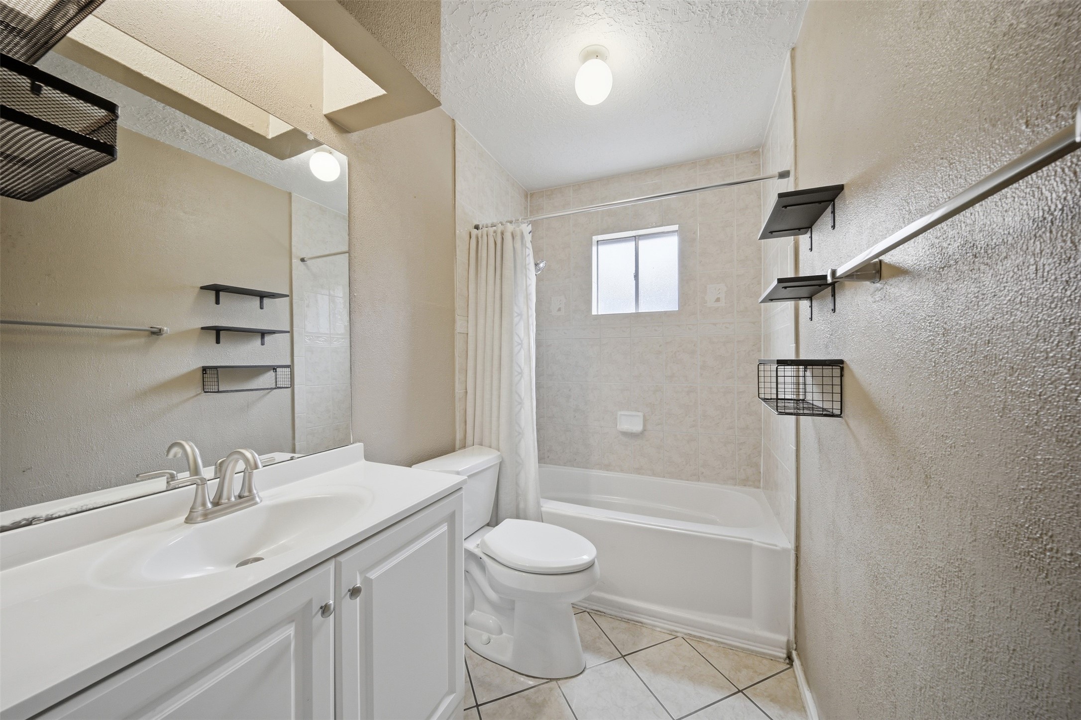 9418 Kilrenny Drive Spring, TX 77379 - Photo 33 of 47 a bathroom with a granite countertop sink a toilet and shower