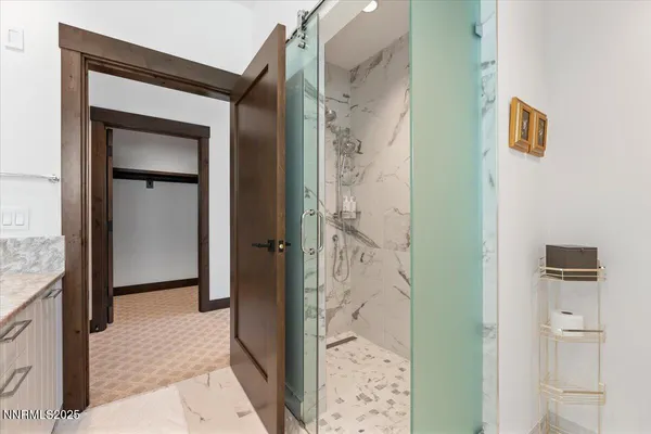 a bathroom with a shower and a mirror