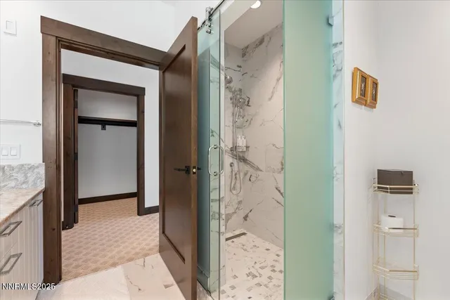 a bathroom with a shower and a mirror