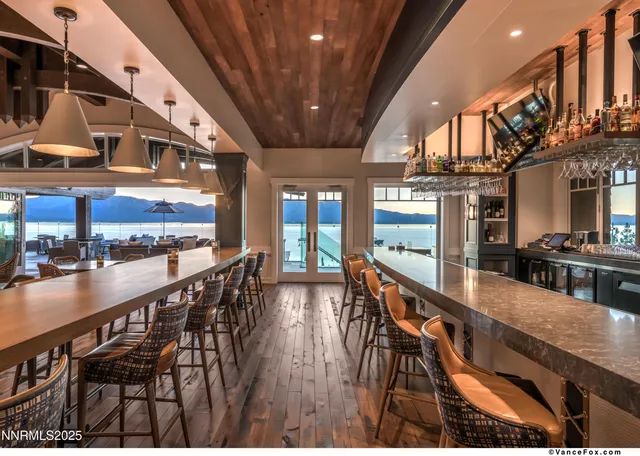a kitchen with stainless steel appliances granite countertop a stove a sink and a wooden floors