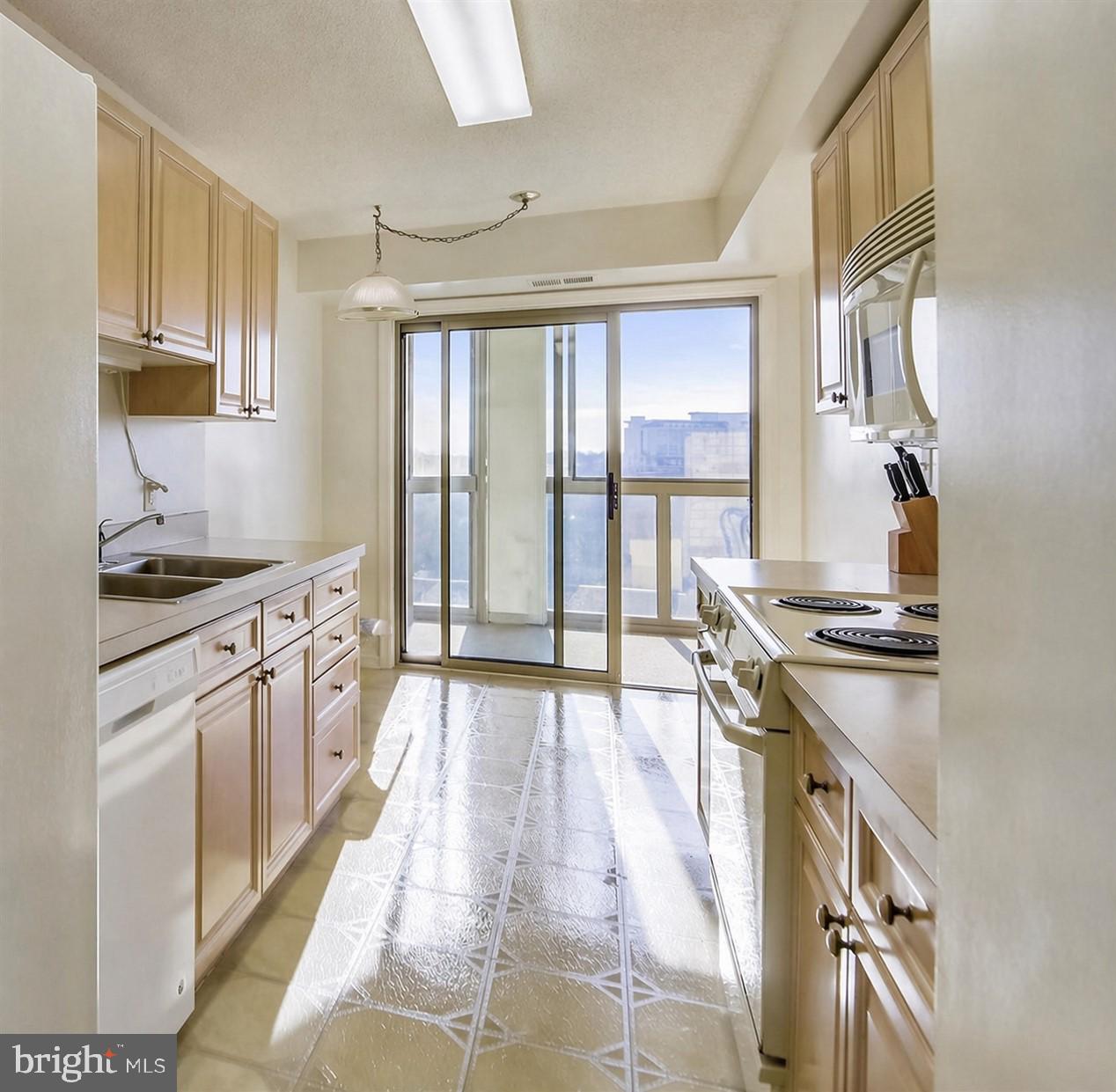 19385 Cypress Ridge Terrace, Unit 920 Leesburg, VA 20176 - Photo 10 of 40 Bright and airy kitchen with a view.