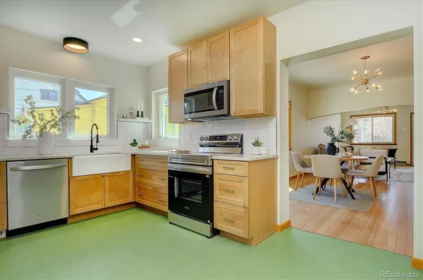 a kitchen with stainless steel appliances granite countertop a stove and a sink