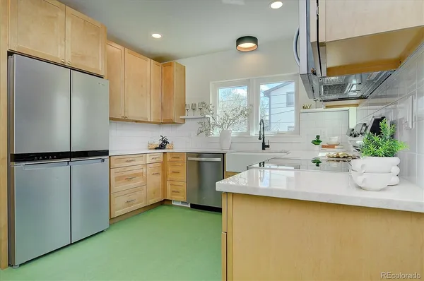 a kitchen with sink cabinets and window