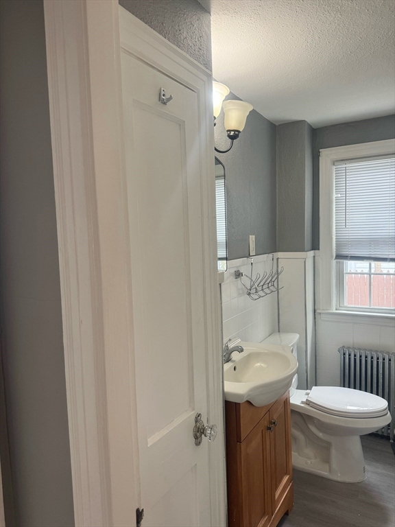 90 Elijah Street Springfield, MA 01109 - Photo 27 of 42 a bathroom with a sink a toilet and shower