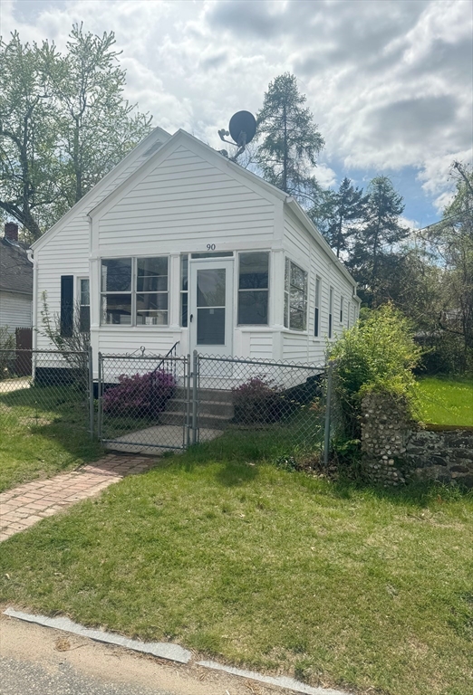 90 Elijah Street Springfield, MA 01109 - Photo 3 of 42 a view of a house with a yard