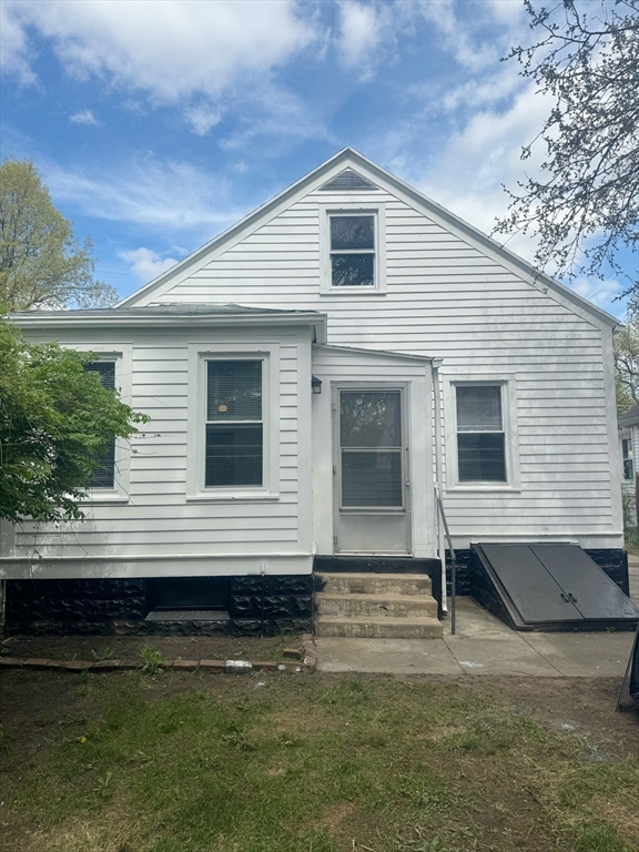 90 Elijah Street Springfield, MA 01109 - Photo 9 of 42 a front view of a house with a yard