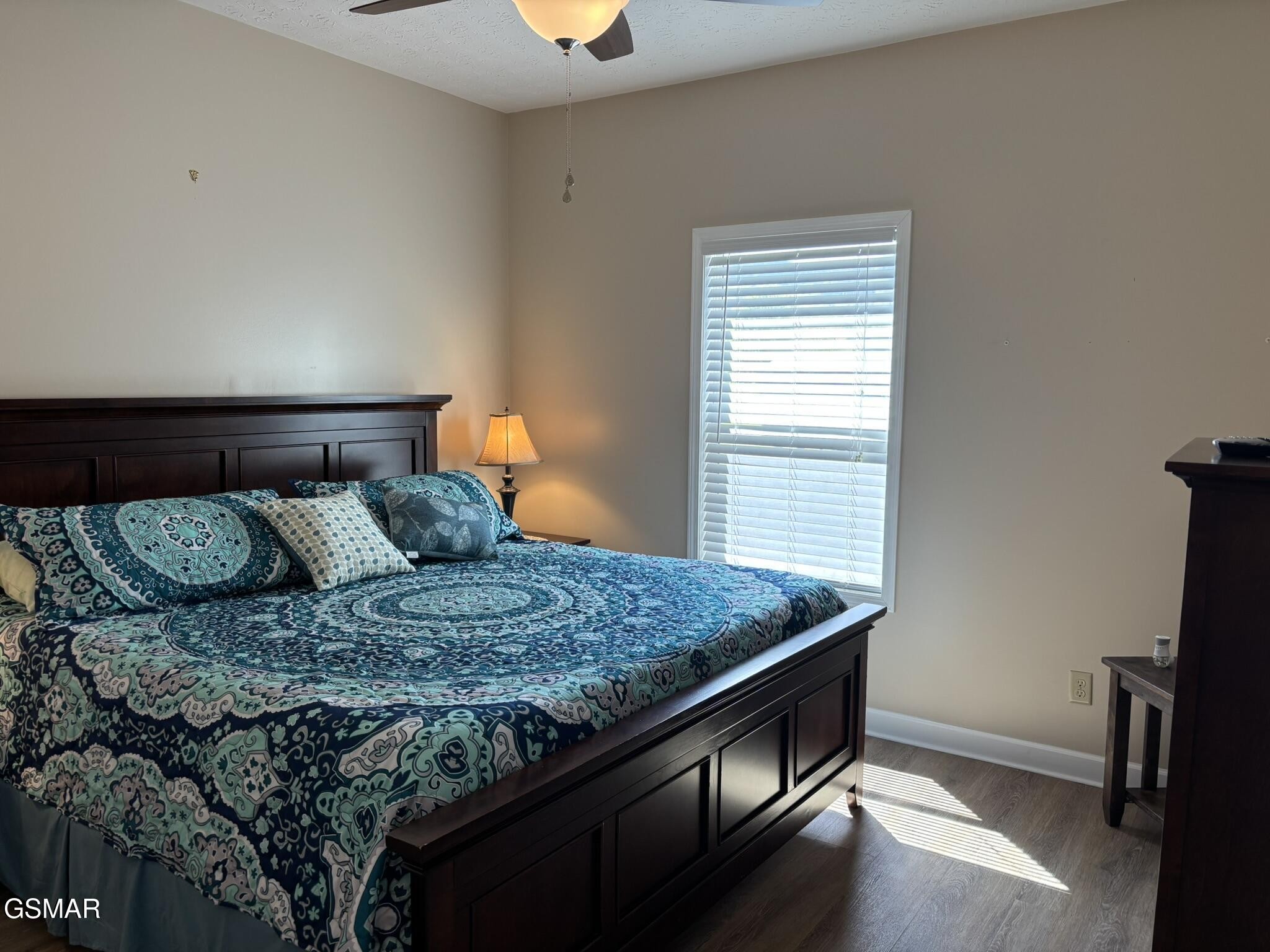 147 Padgett Mill Road Cosby, TN 37722 - Photo 10 of 36 a bed sitting in a bedroom next to a window