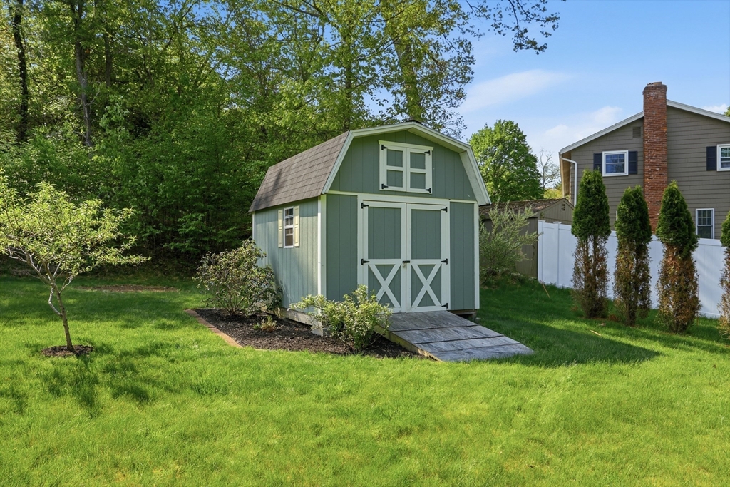 33 Simon Willard Road Acton, MA 01720 - Photo 33 of 42 a front view of a house with a yard