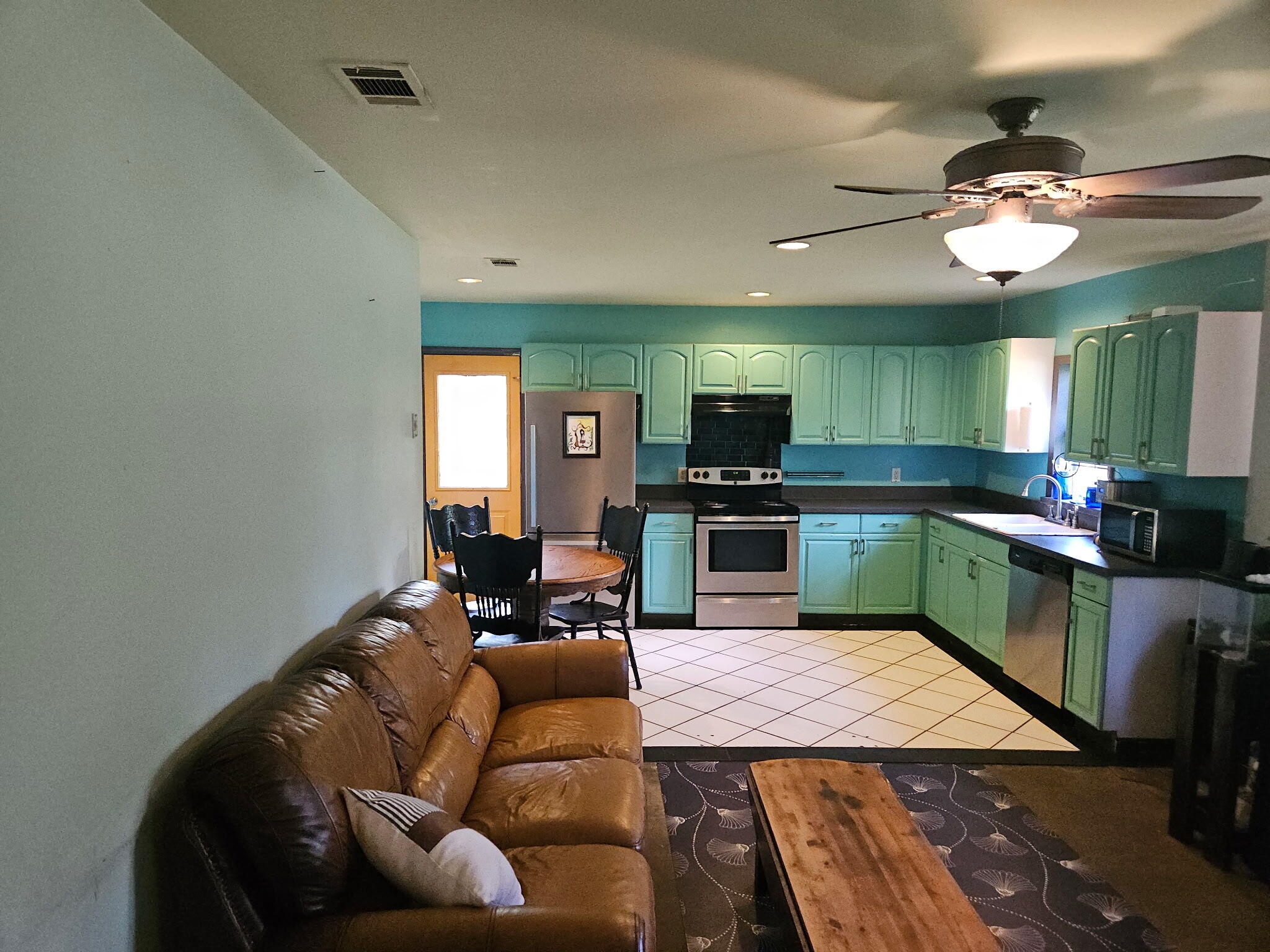 400 7 Oaks Road DeFuniak Springs, FL 32433 - Photo 5 of 17 a living room with furniture and a wooden floor