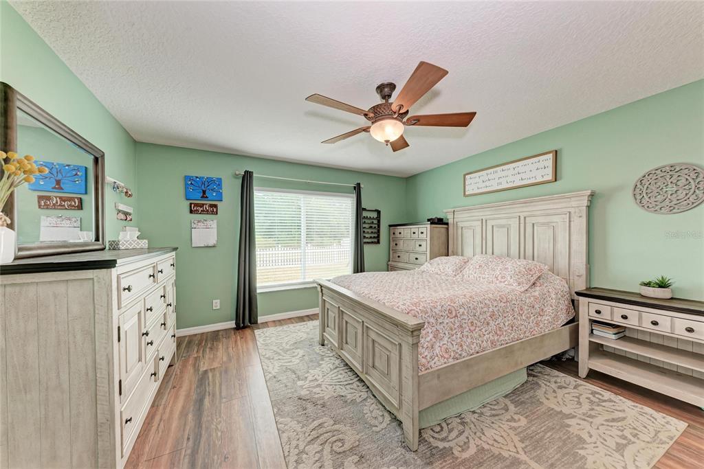 4608 Oliver Manor Drive Parrish, FL 34219 - Photo 14 of 45 a bedroom with a bed dresser and window