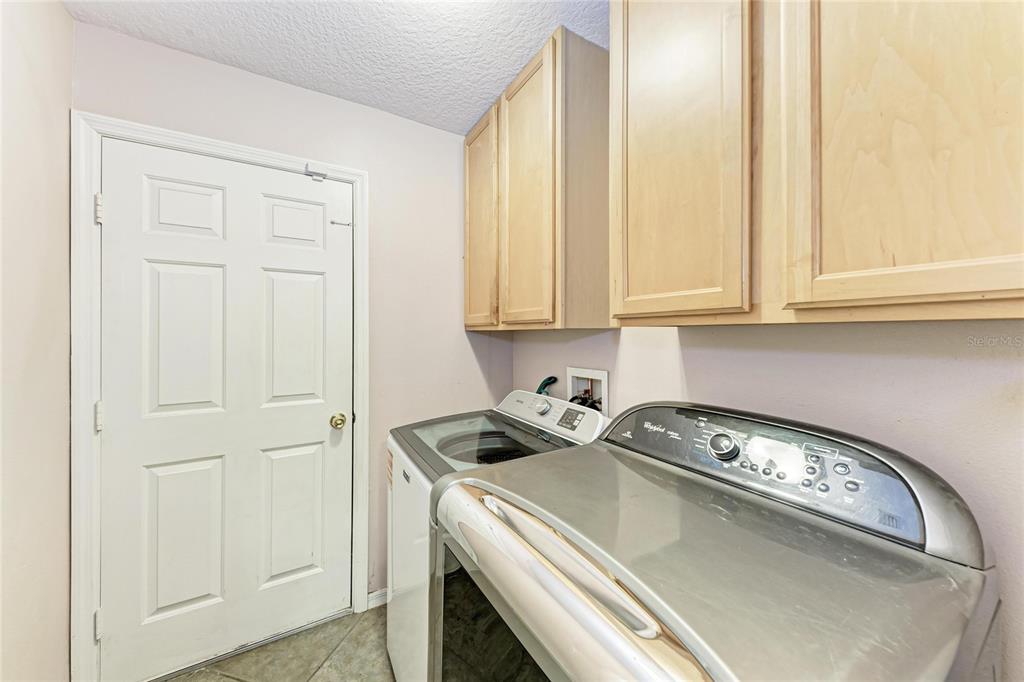 4608 Oliver Manor Drive Parrish, FL 34219 - Photo 28 of 45 a utility room with dryer and washer
