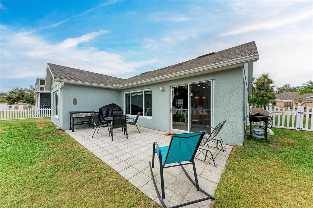 4608 Oliver Manor Drive Parrish, FL 34219 - Photo 29 of 45 a view of a house with backyard porch and sitting area